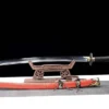 A Chinese Liuyedao sword saber, displayed on a small wooden stand, with its scabbard below on the floor.