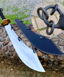 A broad, Chinese ring sword, displayed next to its scabbard, on a rock-wall.