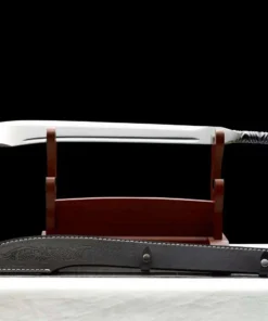A scimitar sword displayed on a wood stand with its scabbard below on the floor.
