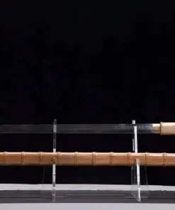 A Shikomizue Katana sword displayed on a small stand next to its wooden scabbard.