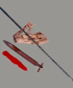 A long folded steel spear weapon, displayed leaning on a wood log, next to its scabbard and tassel.