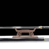 A Chinese straight single edged sword, displayed on a small wooden stand, with its scabbard below on the floor.