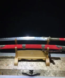 A Chinese two handed saber sword, displayed next to its scabbard, on a small wooden stand.