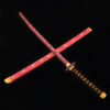 A pink colored wooden Katana sword with its blade laying across its scabbard.