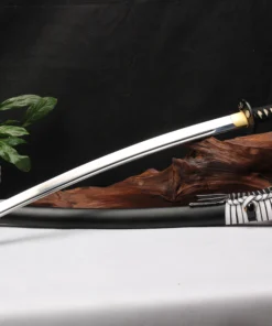 A Japanese Samurai Katana leaning against a small wood log, with its scabbard below on the floor.