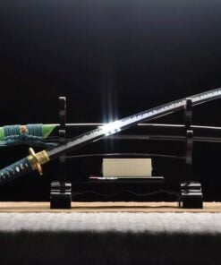 A Shinken green Katana sword displayed next to its scabbard, leaning against a small wooden sword-stand.
