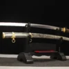 A WW2 Katana, navy officer sword and its decorative scabbard displayed on a small sword-stand.