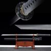 A straight blade, Ninjato sword and its black scabbard displayed on a wooden stand.