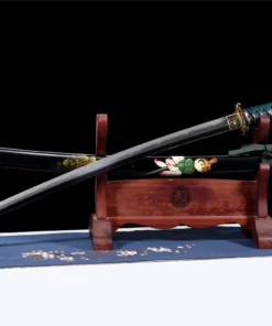 A Shinken green Katana sword displayed next to its scabbard, on a small wooden stand.