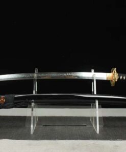 A Japanese snake sword Katana displayed on a small stand alongside its scabbard.