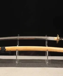 A T10 sword Katana displayed next to its wooden scabbard, on a small stand.