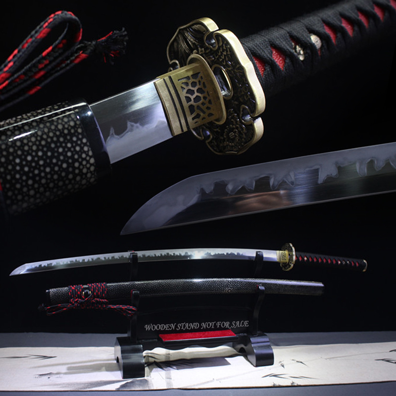 Black and Red Katana A black and red Katana sword, displayed on a wooden stand, alongside its scabbard.