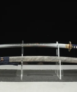 A Katana flower sworddisplayed next to its scabbard, on a small stand.
