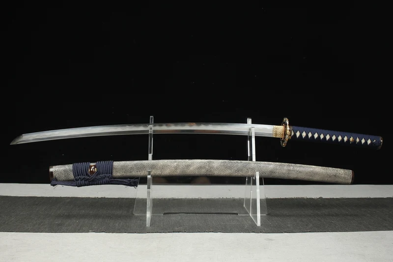 Flower Sword A Katana flower sworddisplayed next to its scabbard, on a small stand.