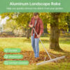 A man raking leaves on grass ground with a large groundskeeper rake tool.