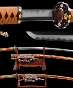 A brown colored Japanese Tachi sword and its decorative scabbard displayed on a small wooden stand, with a sheathed Tachi Katana on a stand below, along with sword highlights above.