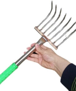 A hand holding a beach clam rake.
