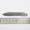 A Damascus steel pocket knife blank displayed alongside a measurement ruler.