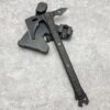 A spike tomahawk axe, displayed resting against its tactical axe sheath.
