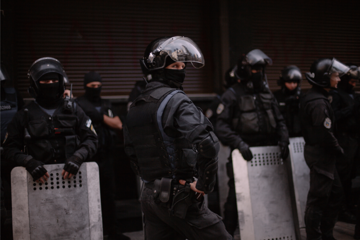 Men holding ballistic shields