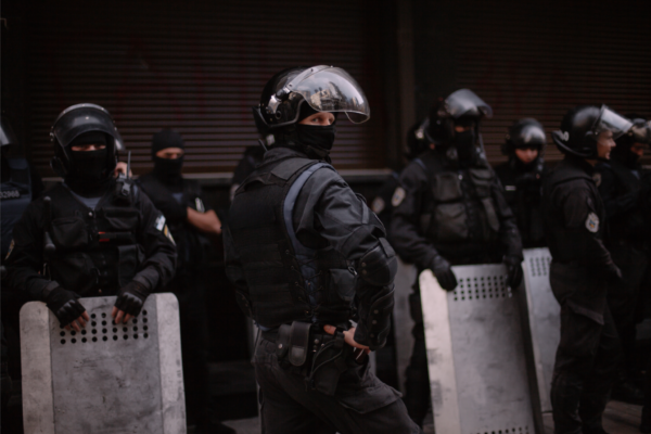 Men holding ballistic shields