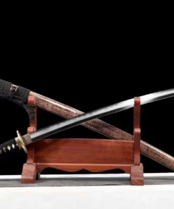 A Japanese Samurai Katana and its beautiful scabbard displayed against a small wooden sword stand.