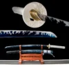 A decorative sword Katana and its scabbard displayed on a small wooden stand, with sword highlights above.