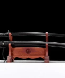 A training Iaido Katana with a black blade, displayed next to its scabbard on a small wooden stand.