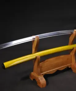A Iaito practice sword Katana and its yellow colored scabbard displayed on a small wooden-stand.