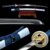 A Japanese Katana sword and its sky blue scabbard displayed on a wooden sword stand, with sword highlights below.