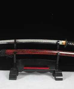 A full tang Katana displayed next to its scabbard, on a small wooden sword-stand.