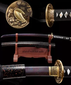 A Wakizashi Iaito sword displayed next to its scababrd, on a small wooden sword-stand.