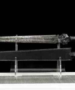 A modern gladius sword, displayed next to its sheath, on a small stand.