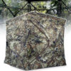 A hunting tent with a bionic camouflage pattern, displayed erected.