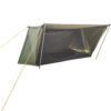 A green colored bushcraft tent displayed erected with its front canopy opened.