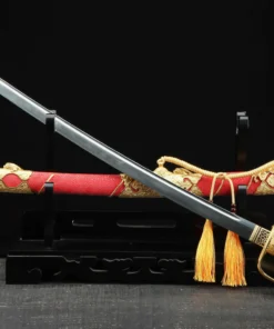 A Kyu Gunto Japanese officer sword, displayed crossed against its decorative scabbard, on a small wooden sword-stand.
