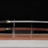 A reverse sword displayed next to its wooden scabbard, on a small plastic sword-stand.