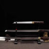A Samurai sword set of 3, including a Shikomizue, Wakizashi and Tanto knife, all displayed on a single sword stand.