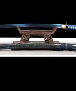 A Katana Iaido sword with a blue blade, displayed on a small wooden stand, with its decorative scabbard below on the floor.