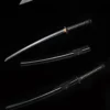 A black colored sharp Katana sword displayed next to its scabbard, along with the same sword shown below, sheathed.