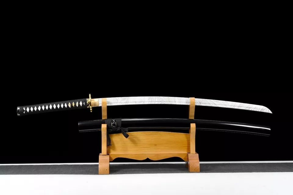 Plastic Sword A plastic sword Katan, displayed alongside its scabbard, on a small wood sword stand.