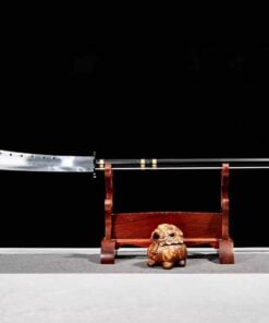 A two handed pole sword displayed on a wooden stand.