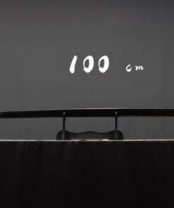 A hardwood Bokuto sword displayed on a smal, wooden sword-stand.