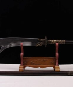A Kwan Dao weapon displayed on a wooden-stand, with its handle extension on the floor below.