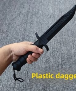 A man's hand holding a plastic training knife.