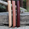 Three wooden Tanto bokken knives displayed side-by-side.