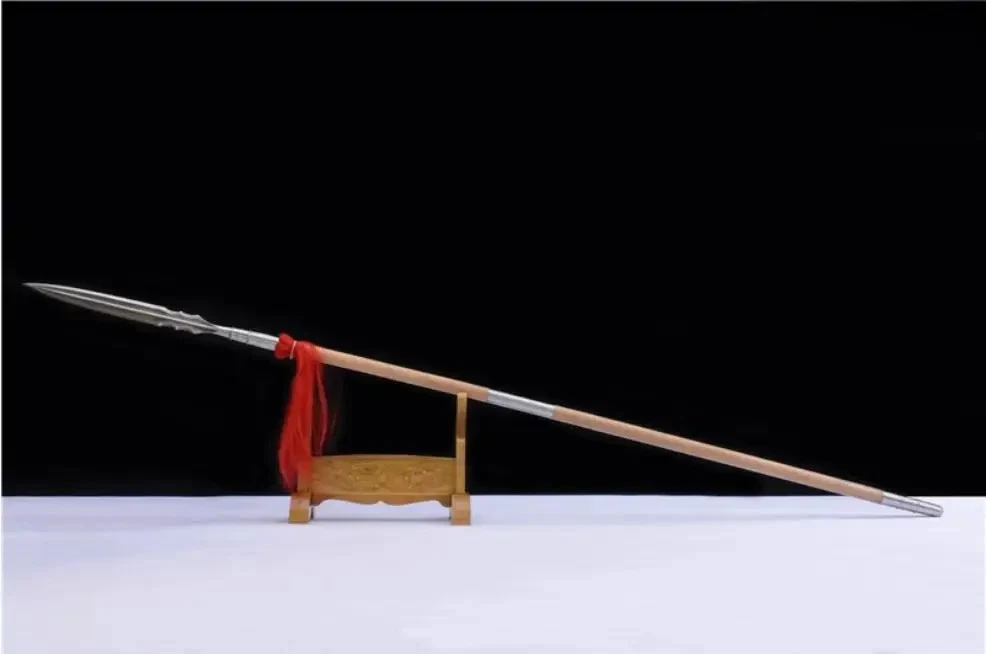 Thrusting Spear A Chinese thrusting spear weapon, displayed leaning against a small wooden stand.