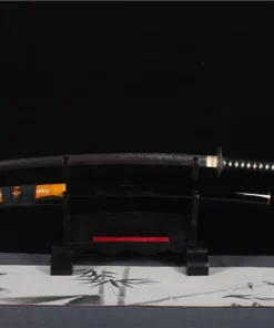 A Buddha sword Katana, displayed next to its scabbard, on a small wooden stand.