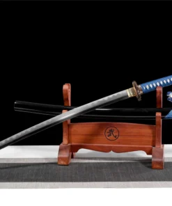 A real demon destroyer sword Katana, displayed next to its scabbard, on a small wooden stand.