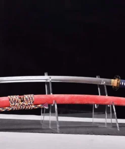 A devoted dragonfly sword Katana, displayed next to its scabbard, on a small stand.